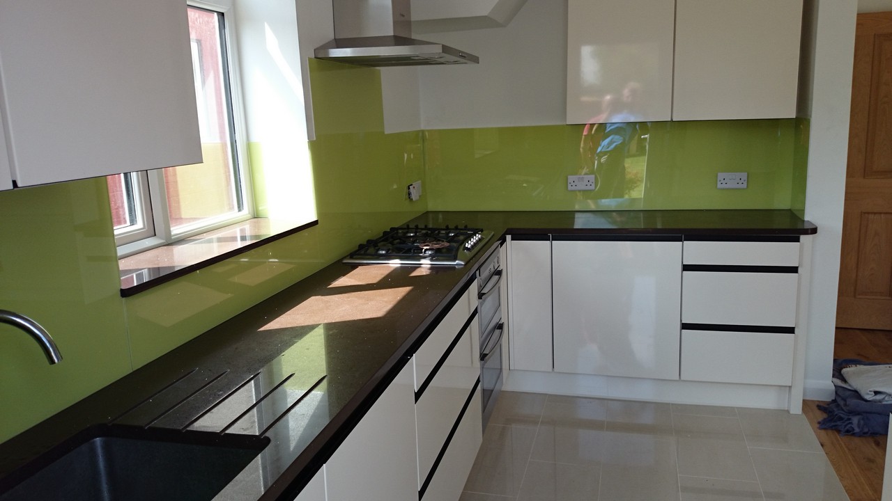 Lime green glass kitchen splashback installed by Watford glaziers